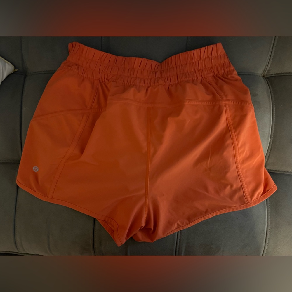 Orange lululemon track that mid rise shorts